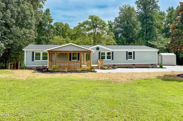 a house with swimming pool in front of it