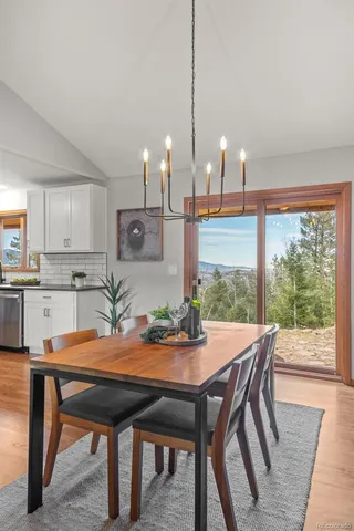 a dining room with furniture and window