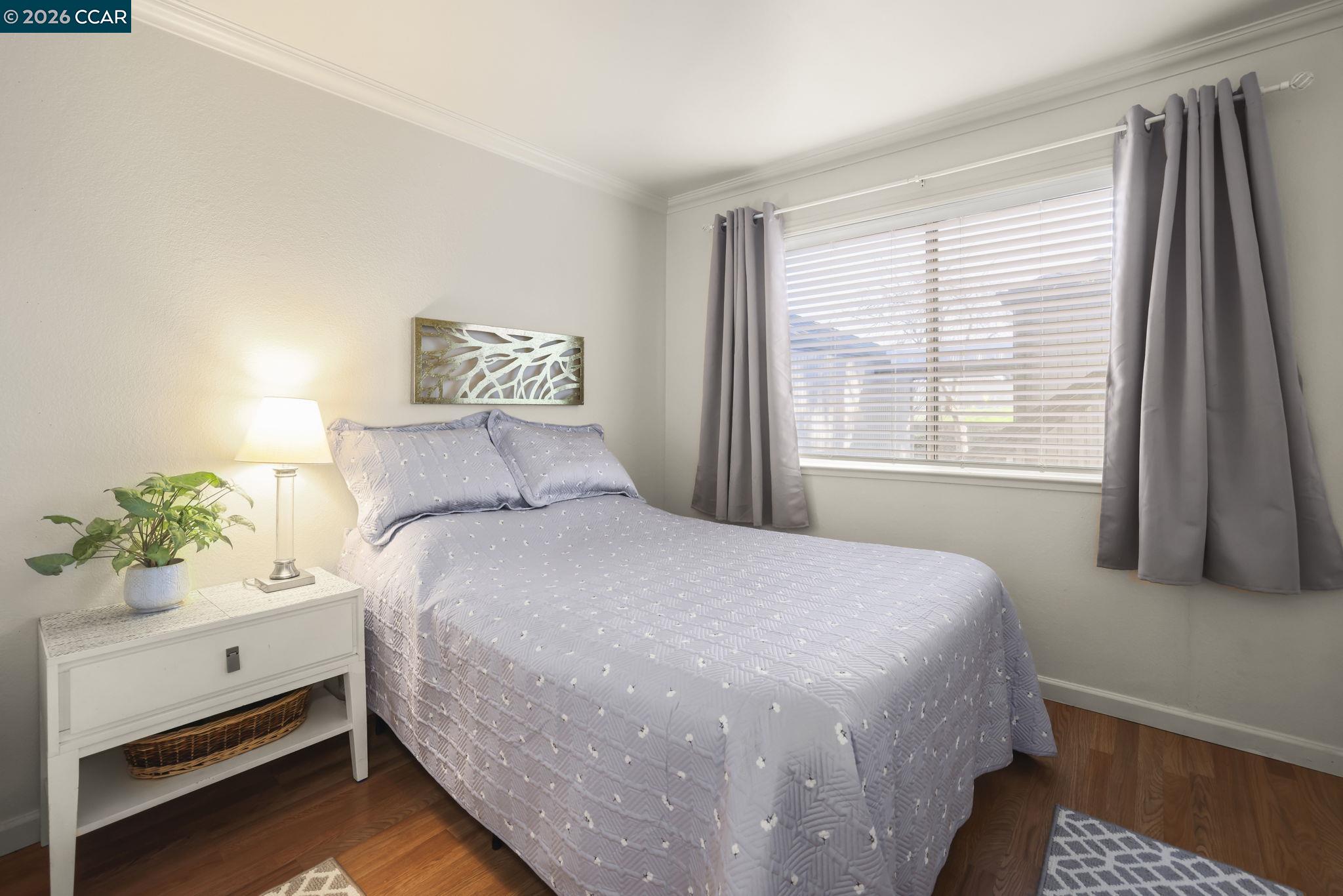 641 Chadwick Lane Bay Point, CA 94565 - Photo 11 of 20 a bedroom with a bed and a window