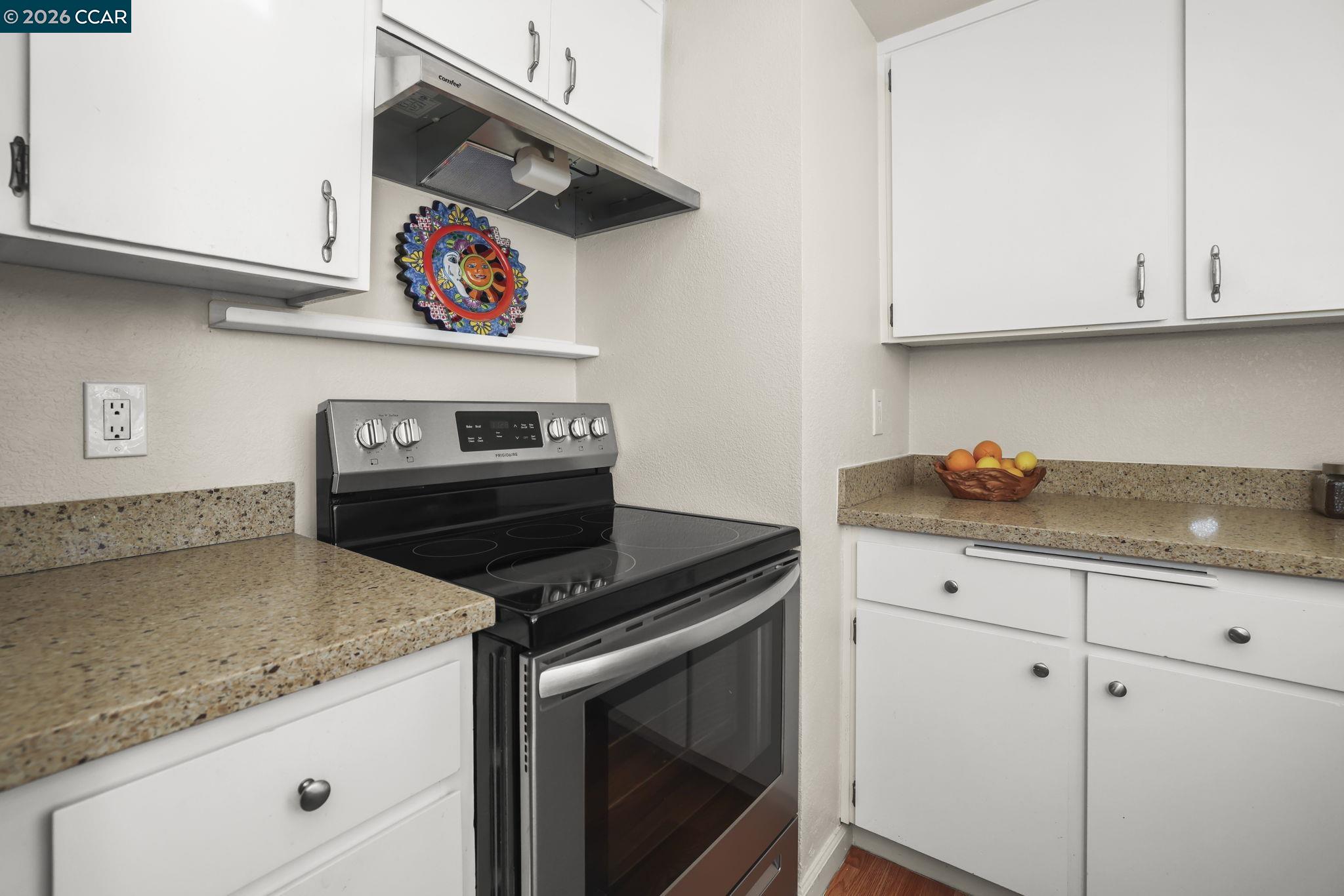 641 Chadwick Lane Bay Point, CA 94565 - Photo 8 of 20 a kitchen with stainless steel appliances granite countertop white cabinets and a stove