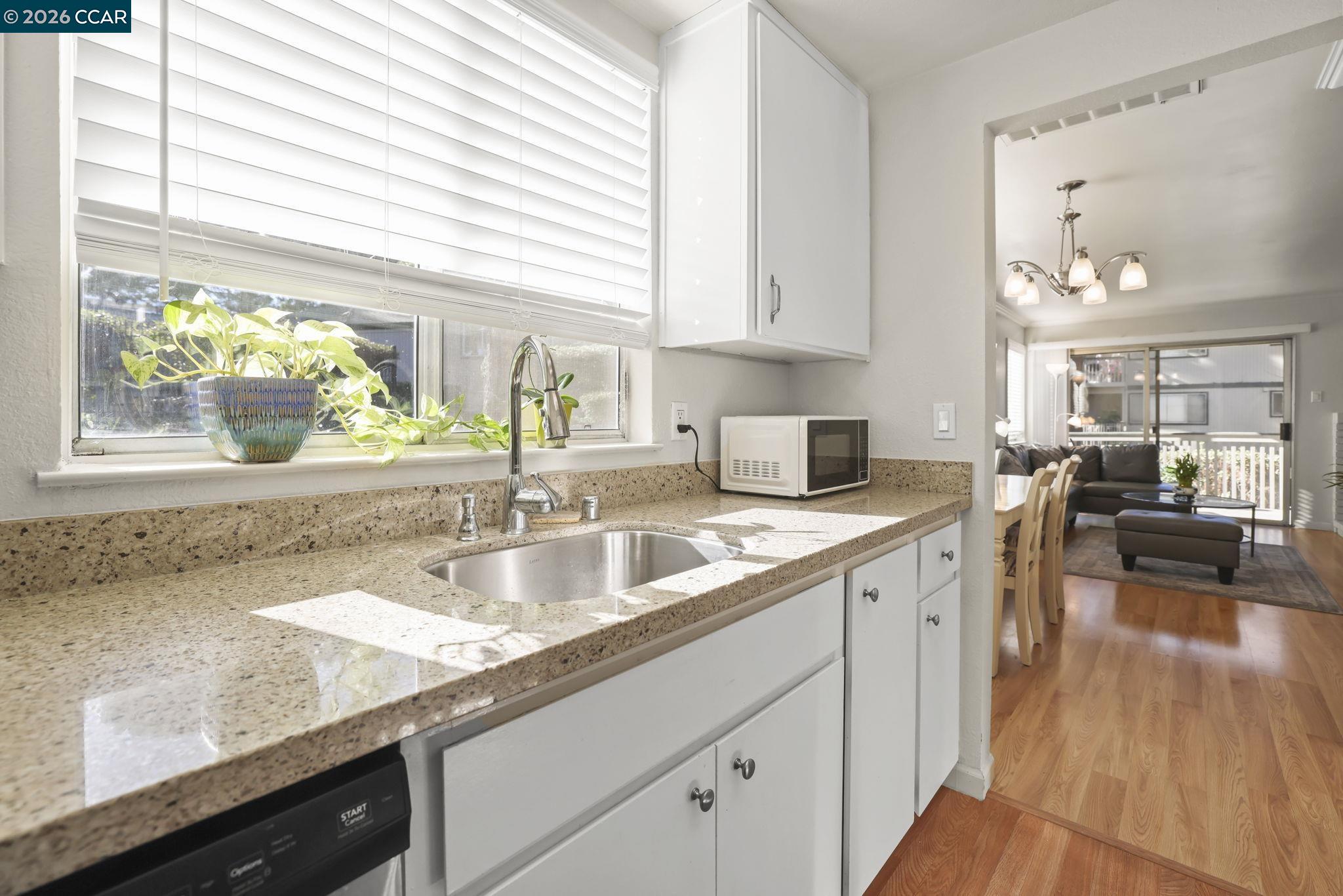 641 Chadwick Lane Bay Point, CA 94565 - Photo 9 of 20 a kitchen with a sink a counter top space and cabinets