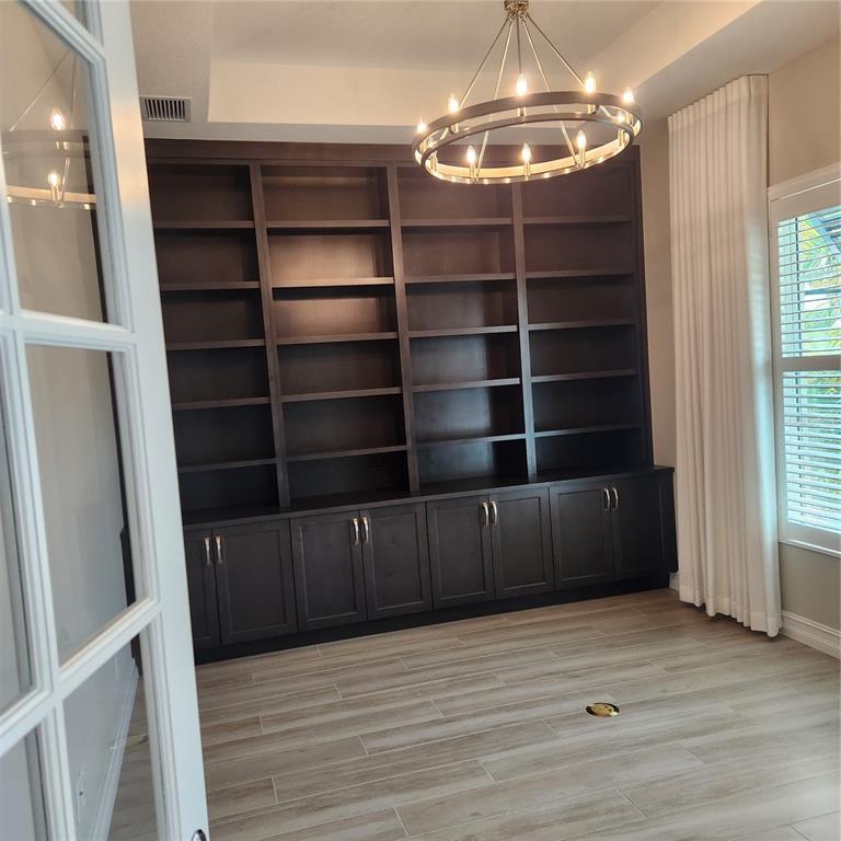 512 Blue Shell Loop Sarasota, FL 34240 - Photo 6 of 44 a view of a room with wooden floor and windows