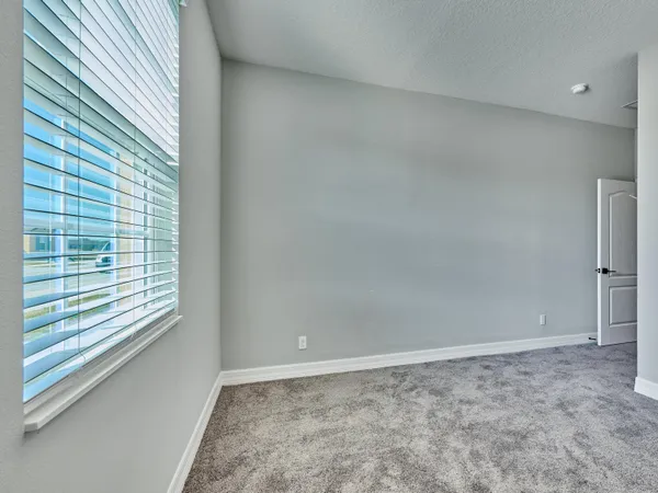 a kitchen with granite countertop white cabinets and stainless steel appliances