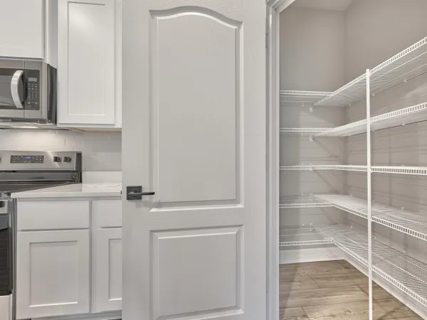 a view of an empty room and a window