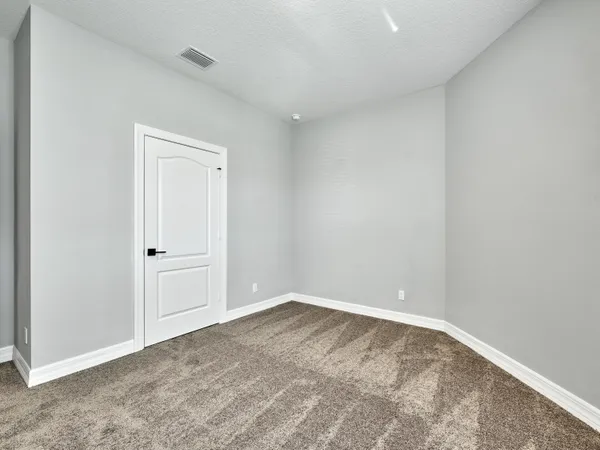 a view of a livingroom with a ceiling fan and window