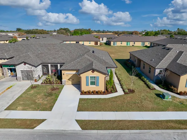 a front view of a house with yard
