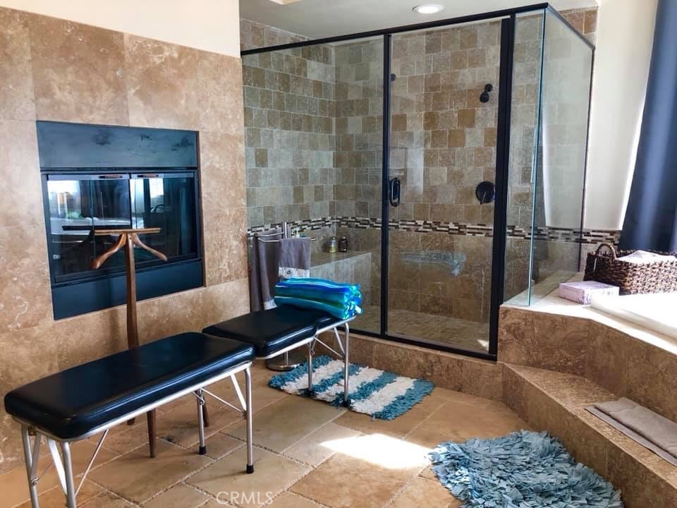 9126 Kittering Road Oak Hills, CA 92344 - Photo 28 of 47 master bathroom with fireplace