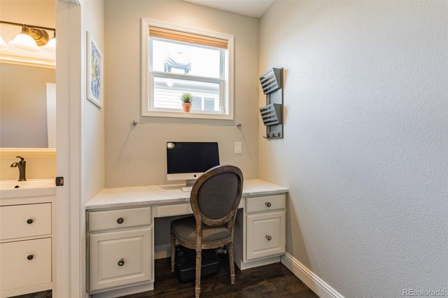 a room with a chair and a window