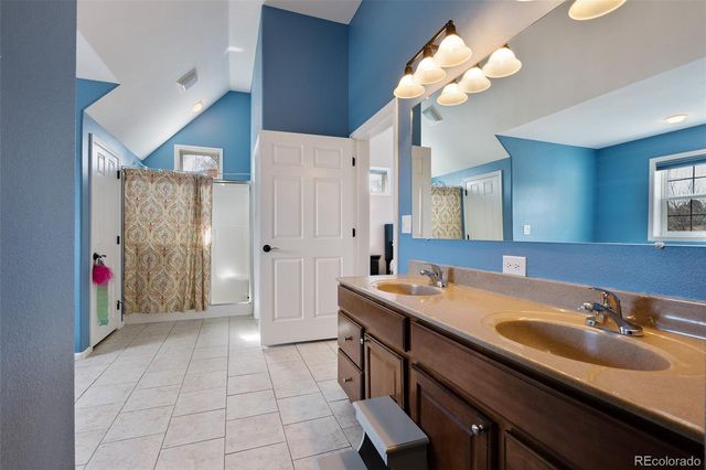 a bathroom with a sink a vanity and a mirror