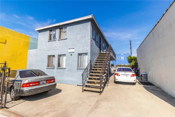 a view of building with cars