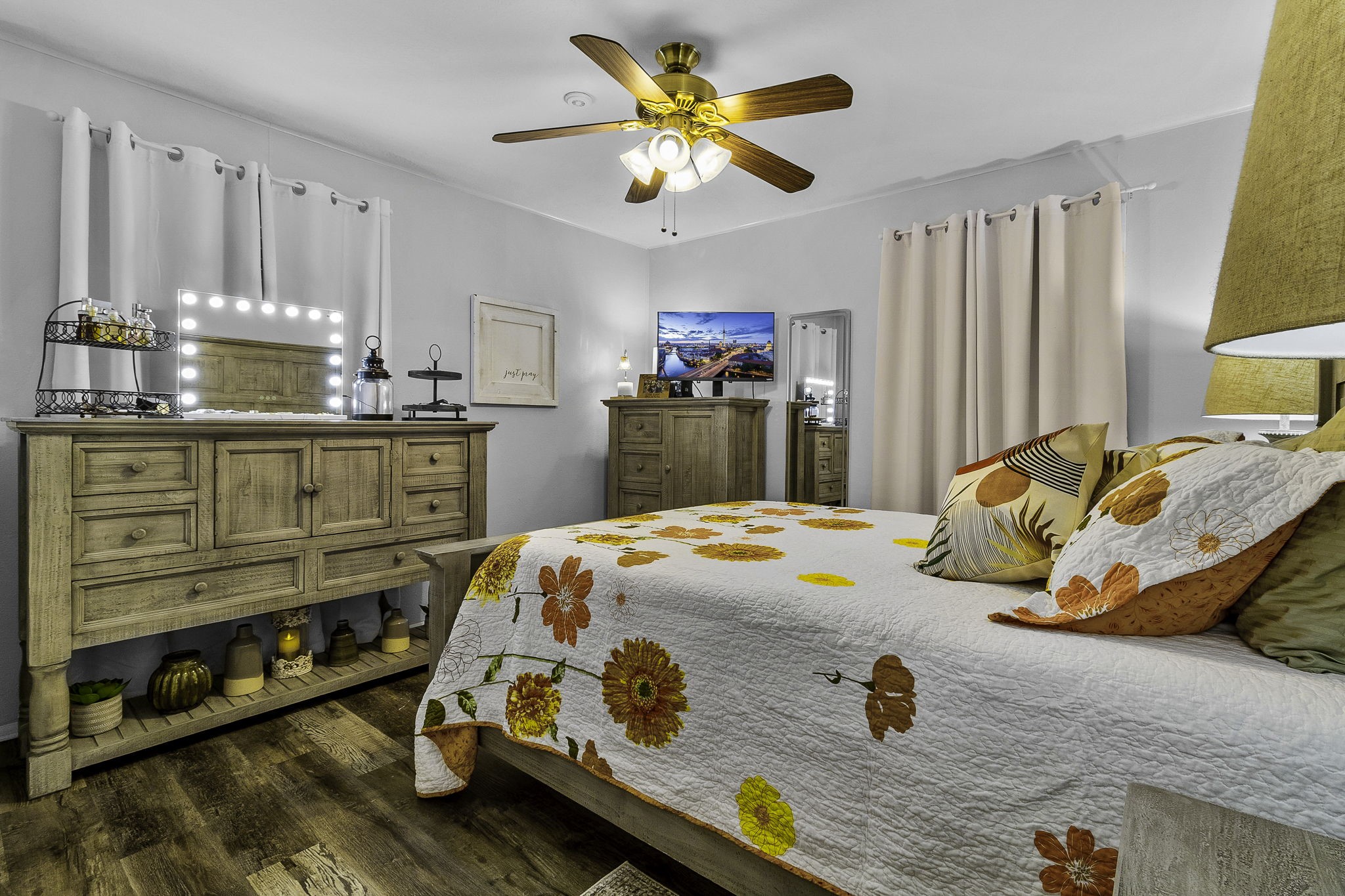 188 Huckleberry Road Onalaska, TX 77360 - Photo 15 of 49 a bedroom with a bed and a chandelier