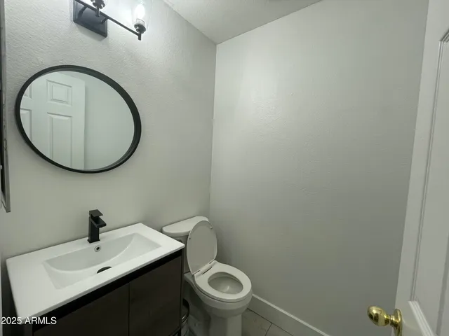 a bathroom with a toilet and a sink