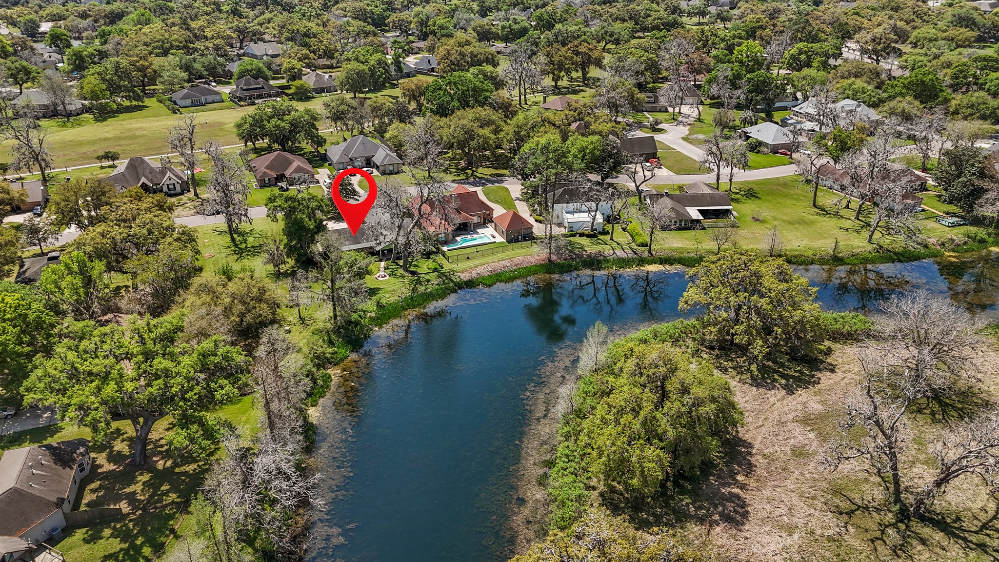 2261 Riverside is a one-of-a-kind waterfront home set on a lush waterfront lot in gated Columbia Lakes, surrounded by Texas native flora and serene bayou views....