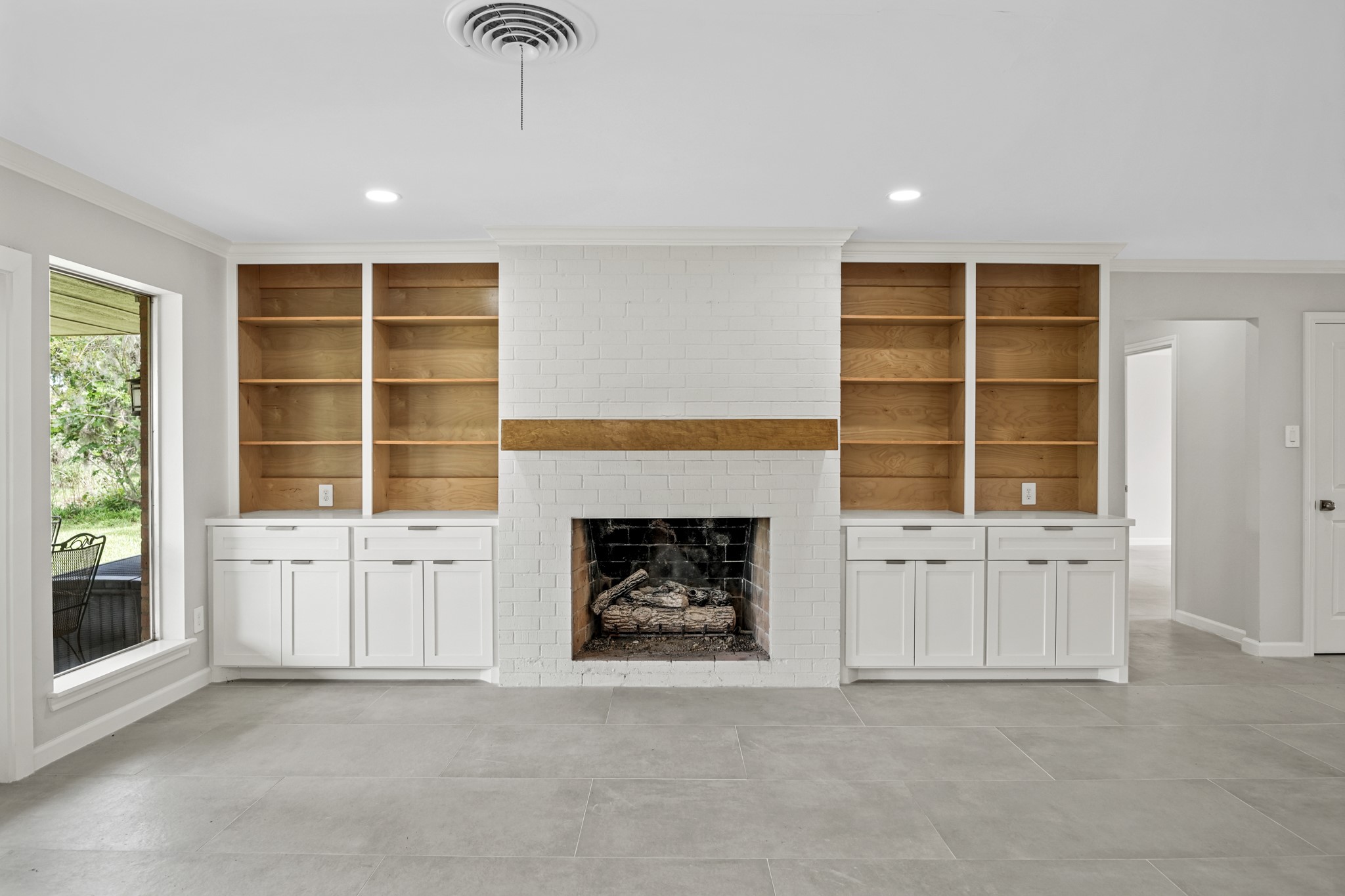 2261 Riverside Drive West Columbia, TX 77486 - Photo 11 of 44 Gaslog fireplace surrounded by custom maple builtins and hand crafted maple mantle...