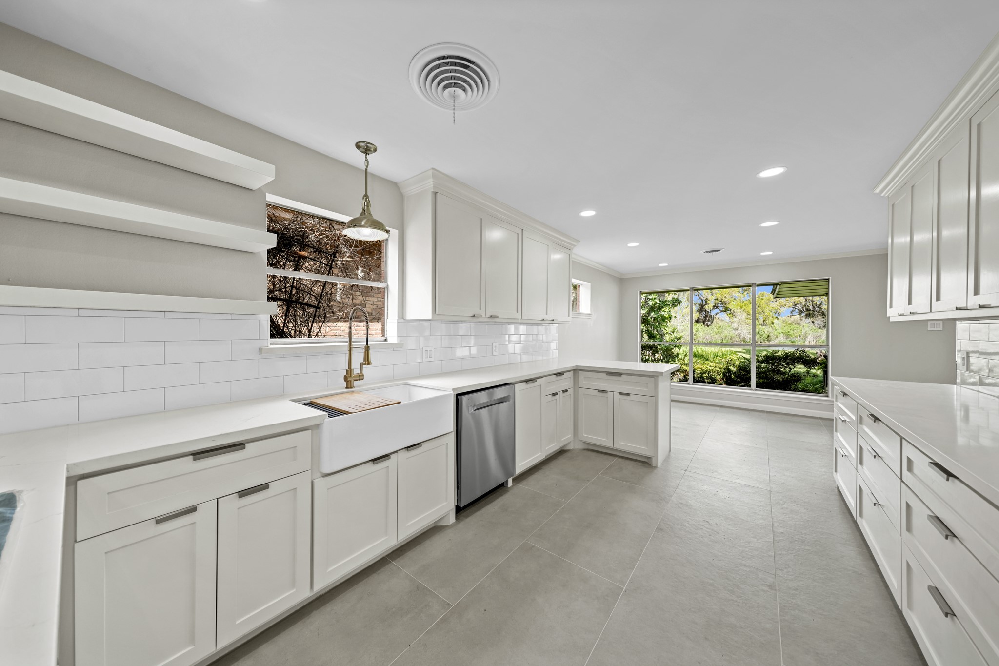 2261 Riverside Drive West Columbia, TX 77486 - Photo 18 of 44 Top-tier appliances—including brand new oven, convection microwave & a quiet, highly rated Midea dishwasher—all overlooking the water and blooming side yard.