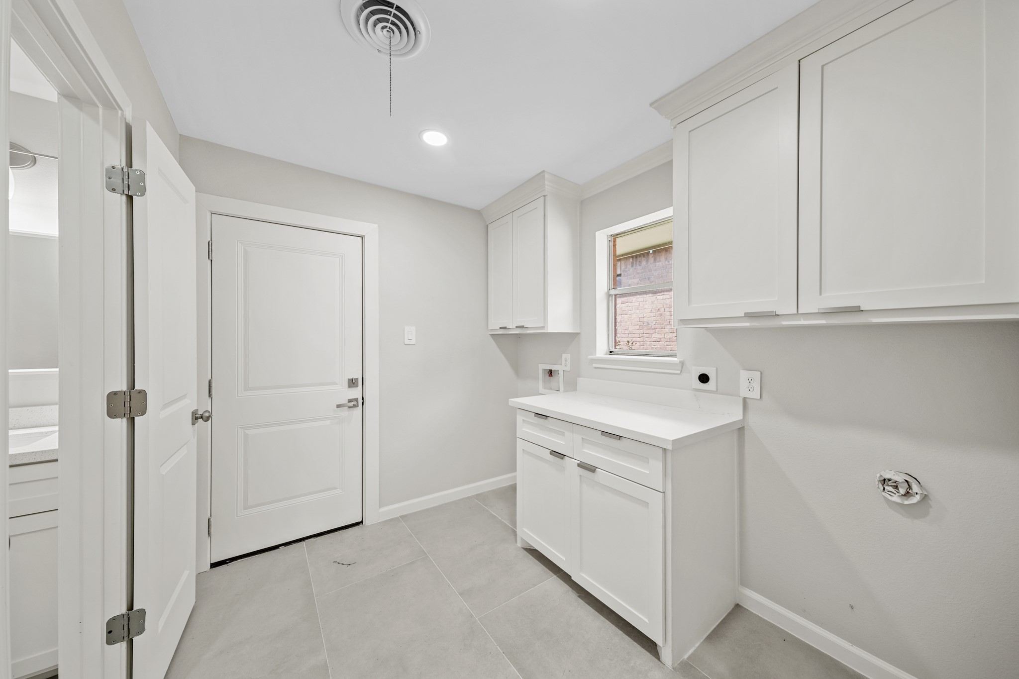 2261 Riverside Drive West Columbia, TX 77486 - Photo 20 of 44 Laundry room offers built ins, folding shelf & room for additional refrigerator or freezer PLUS half bath!