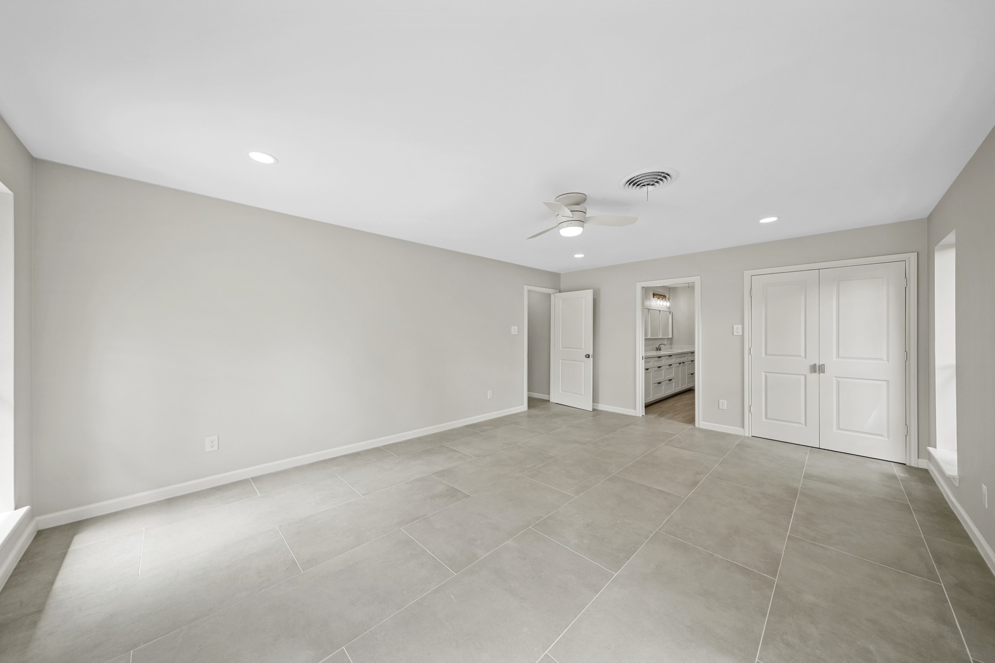 2261 Riverside Drive West Columbia, TX 77486 - Photo 23 of 44 View 2 of Primary retreat showing pocket door entrance to stunning bath and large walk in closet