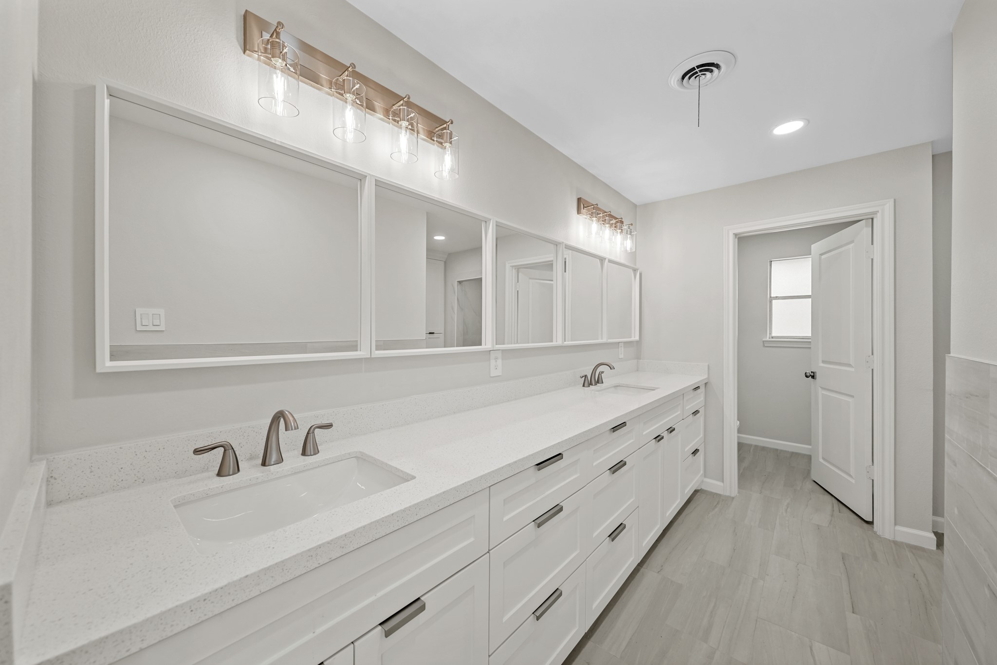 2261 Riverside Drive West Columbia, TX 77486 - Photo 25 of 44 Spa-like primary bath offers double sink quartz vanity that has a ton of storage...bath also has new toilet with bidet.