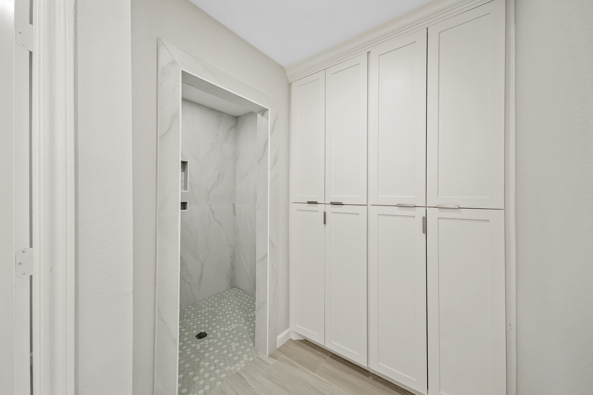 2261 Riverside Drive West Columbia, TX 77486 - Photo 26 of 44 Complete wall of built ins (no lack of storage in this home) next to the oversized shower...shower is handicap accessible.