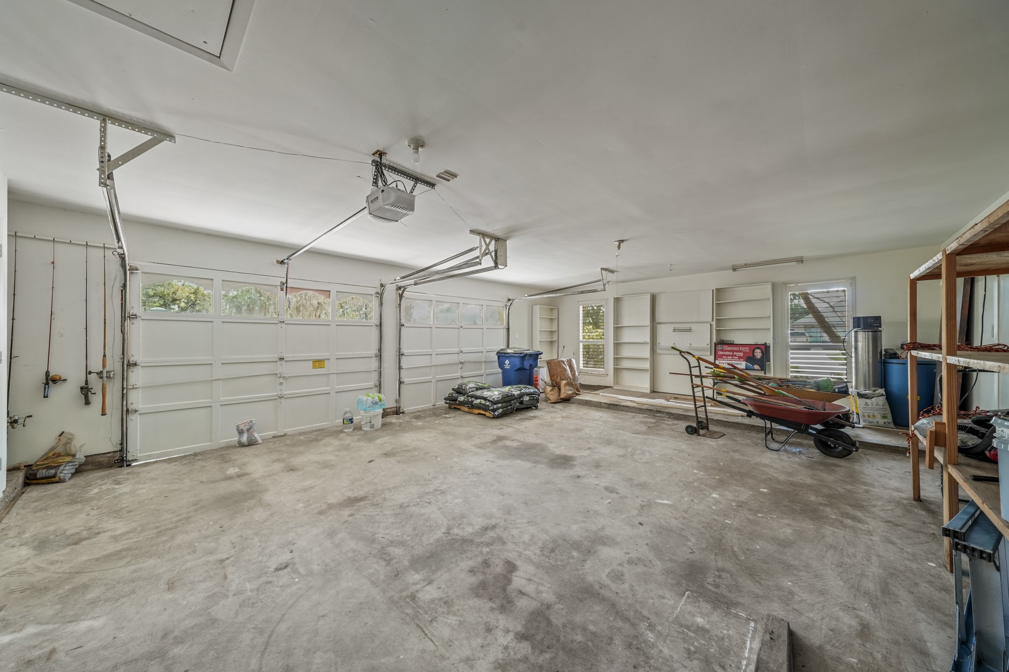 2261 Riverside Drive West Columbia, TX 77486 - Photo 41 of 44 ....inside garage features workshop area, side back door, storage closet and secret attic workshop! Don't miss that on your tour...you may even find some surprises up there!