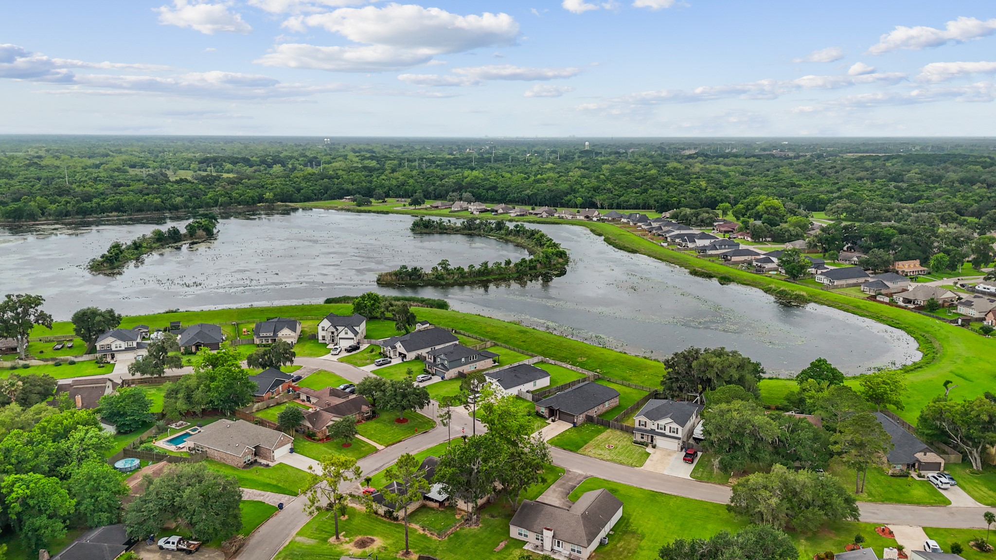 2261 Riverside Drive West Columbia, TX 77486 - Photo 44 of 47 a view of a lake with a city