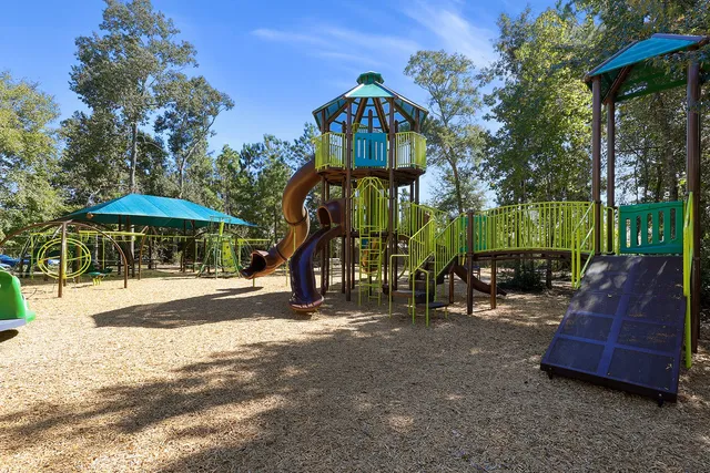 a view of patio with a table and chairs under an umbrella