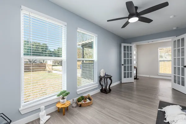 a view of a dining room with furniture and wooden floor