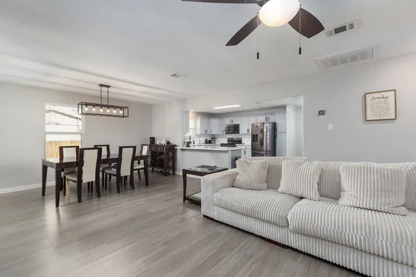 a kitchen with a refrigerator stove and sink