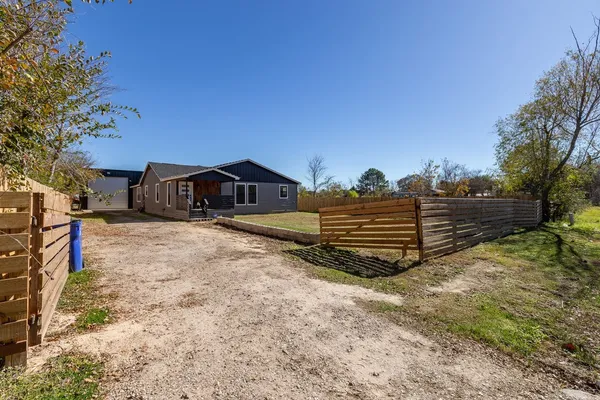 a house view with a backyard space