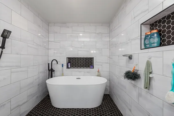 a en suite bathroom with a sink and a mirror