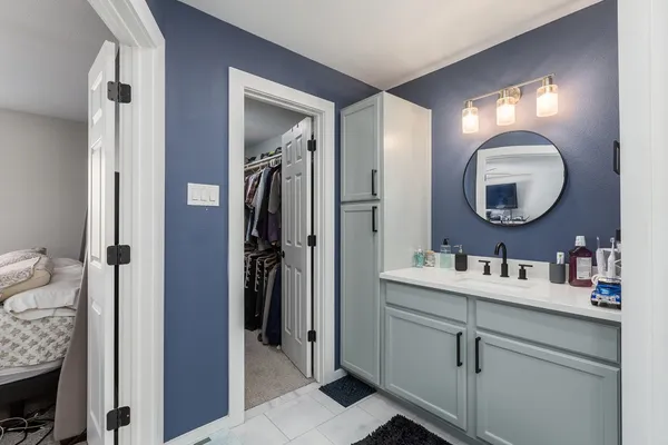 a view of room with workspace and windows