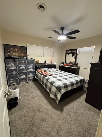 a bedroom with a bed and a walk in closet