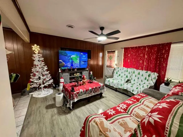 a bedroom with bed and a flat screen tv