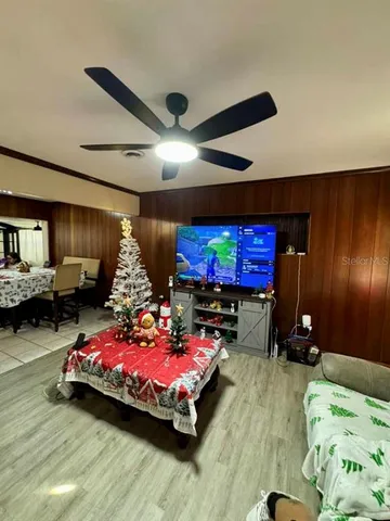 a bedroom with furniture and a flat screen tv