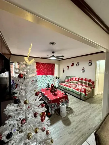 a bedroom with furniture and a chandelier