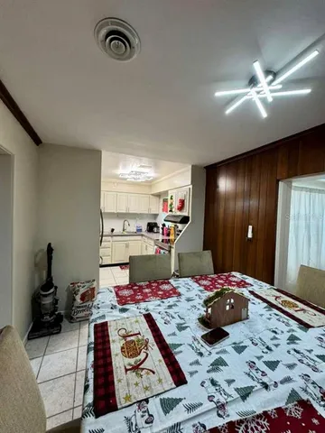 a bed room with a bed and a television