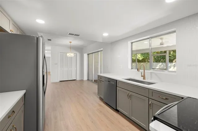 a view of a sink and a window in a room