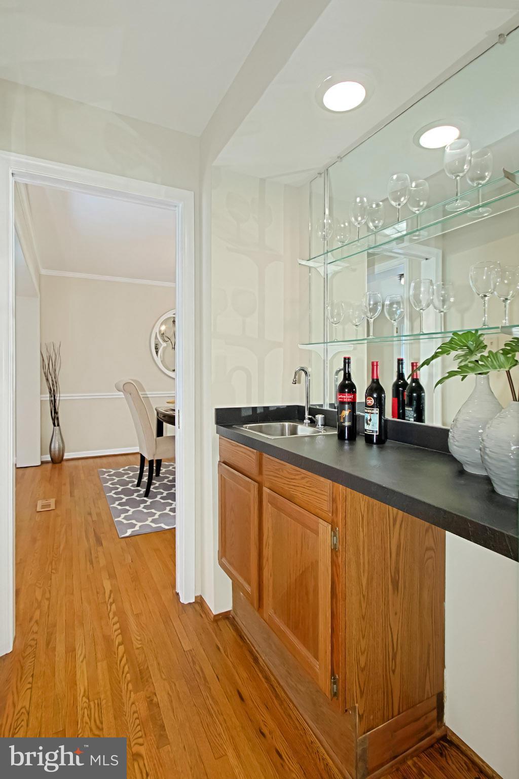 435 Utterback Store Road Great Falls, VA 22066 - Photo 11 of 30 Wet bar between dining and living rooms