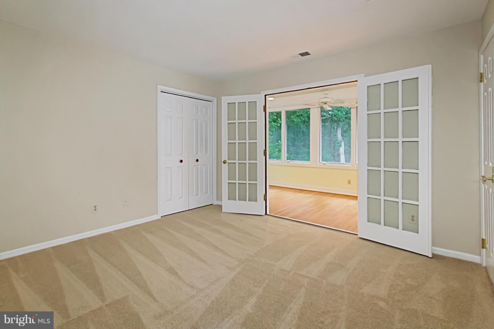 435 Utterback Store Road Great Falls, VA 22066 - Photo 20 of 30 Bedroom with access to sunporch