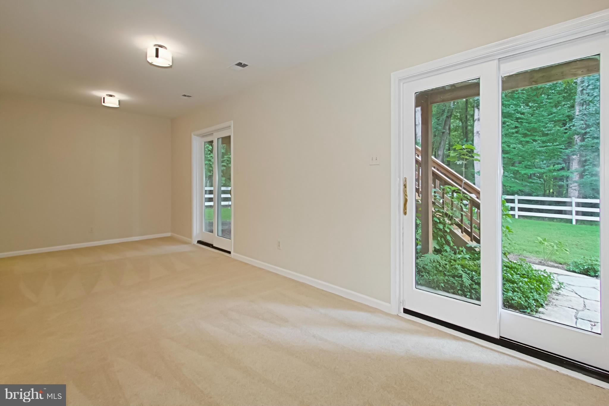 435 Utterback Store Road Great Falls, VA 22066 - Photo 23 of 30 Recreation room with SGD to rear