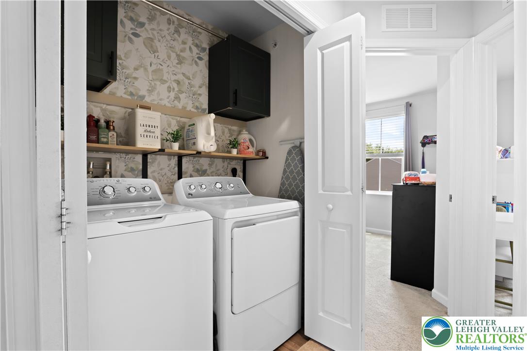 2336 Alex Road Easton, PA 18040 - Photo 19 of 35 Functional laundry nook with washer and dryer, conveniently tucked away behind bi-fold doors.
