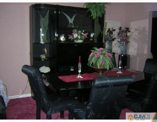 7 Bodnarik Road Edison, NJ 08837 - Photo 3 of 6 a dining room with furniture and chandelier