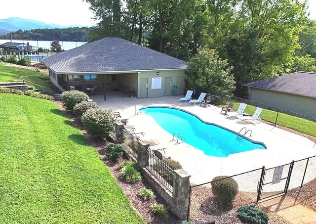 a view of a house with a backyard and a patio