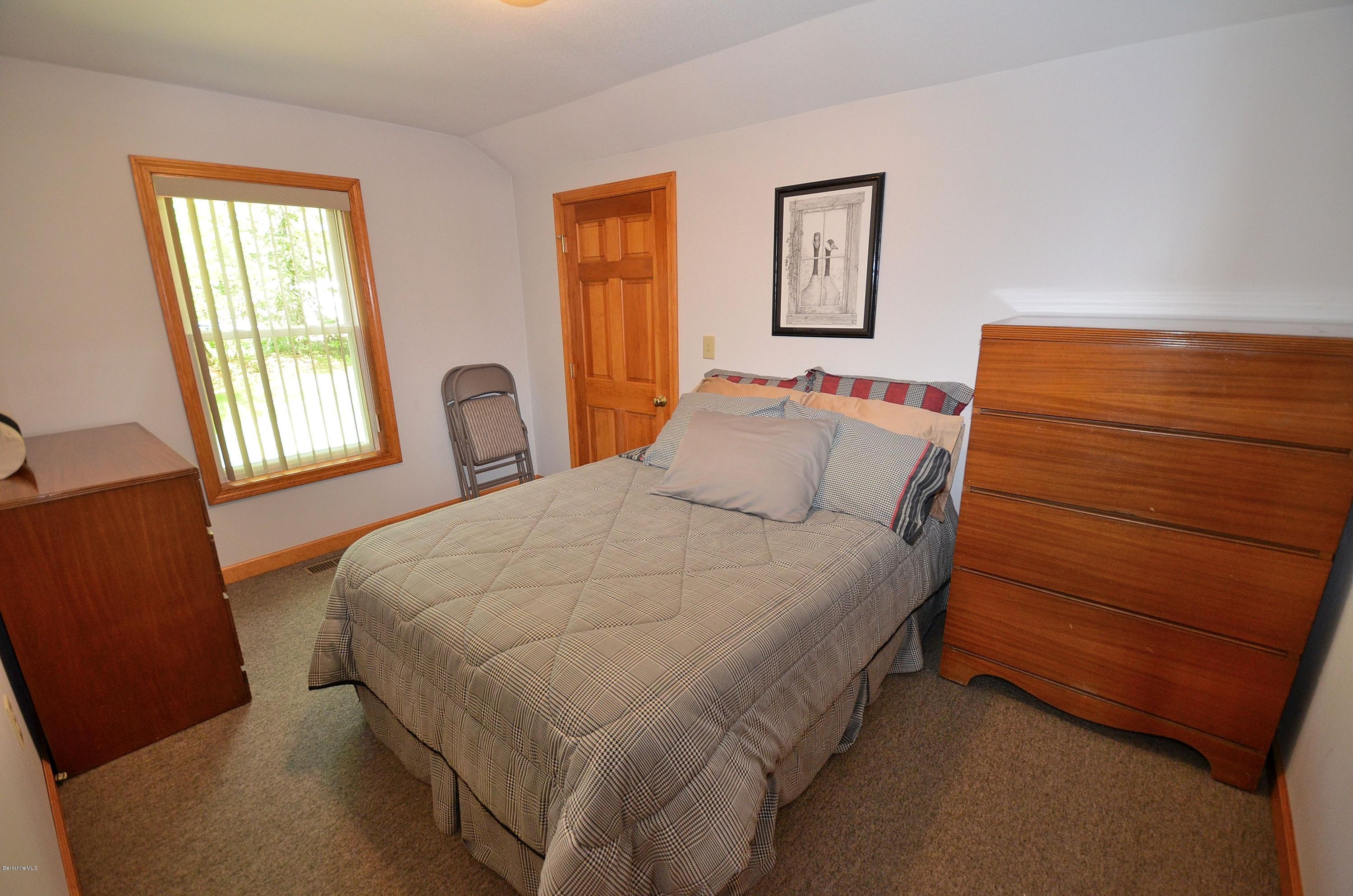 28 Ona Road Tolland, MA 01034 - Photo 13 of 31 a bedroom with a bed chair and window