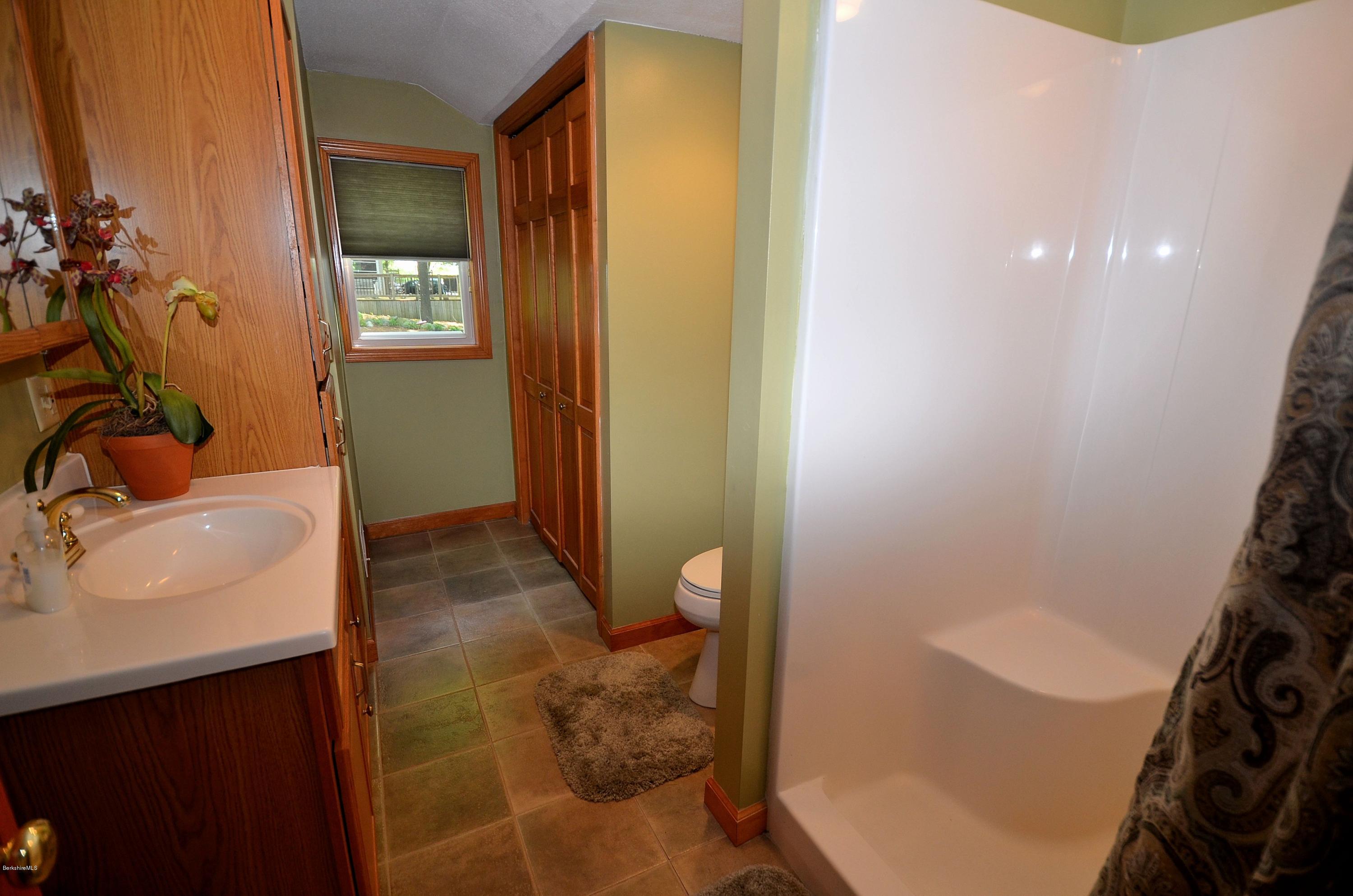 28 Ona Road Tolland, MA 01034 - Photo 15 of 31 a bathroom with a sink and a mirror
