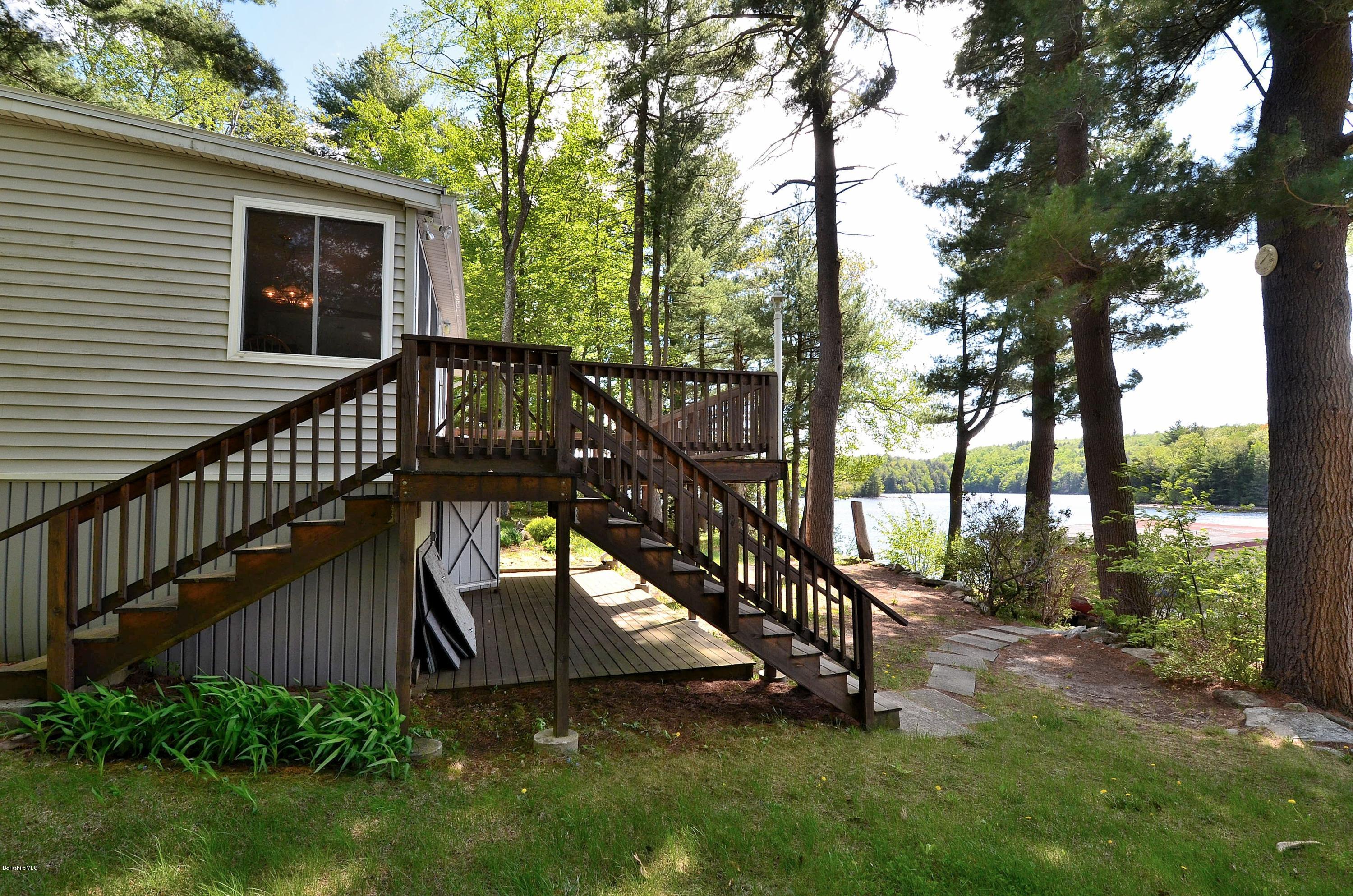 28 Ona Road Tolland, MA 01034 - Photo 16 of 31 a view of a house with backyard and sitting area