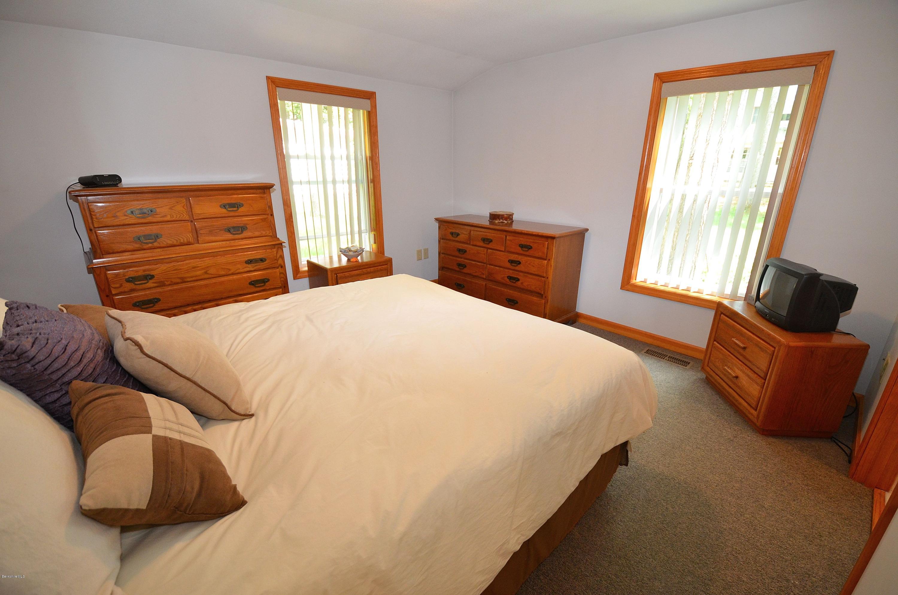 28 Ona Road Tolland, MA 01034 - Photo 10 of 31 a bedroom with a bed and window