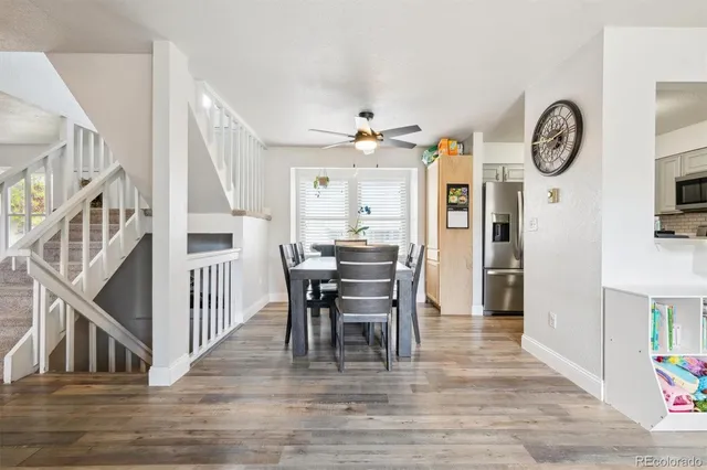 a view of a dining room with furniture and wooden floor