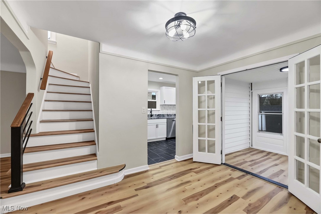 4209 Stilmore Road Cleveland, OH 44121 - Photo 9 of 36 Stairs featuring wood finished floors