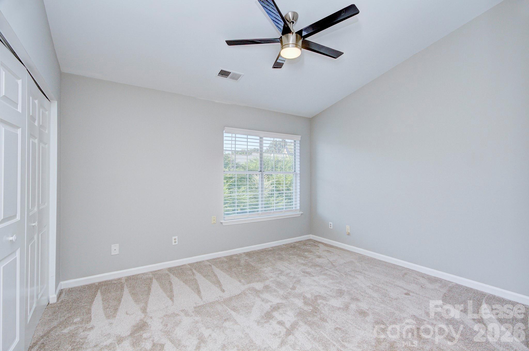 8268 Golf Ridge Drive Charlotte, NC 28277 - Photo 19 of 24 a view of an empty room with a window